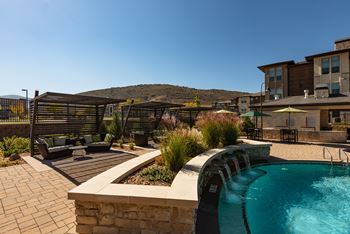 Resort style pool with hot tub, sun deck & fire lounge